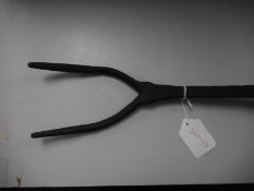 A late 18th century meat roasting jack:, the iron double prong head on an ash shaft,