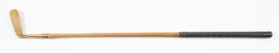 A hickory shaft brass headed putter by Halley, London:, brown leather grip,