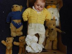 Four various blonde plush Teddy bears together with a composition headed baby doll and a white
