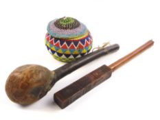 An African carved truncheon together with a knobkerry and a beadwork bowl and cover:,