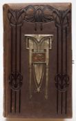 An early 20th century leather carte de visite album and contents:, mainly family portraits.
