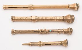 A late 19th /early 20th century yellow metal propelling pencil with coiled snake slider:,