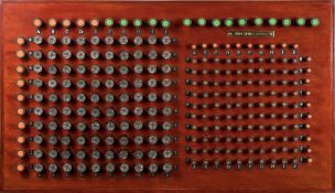 A game of battleships constructed with used shotgun cartridges:,