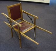 An early 20th century oak frames folding sedan chair:.