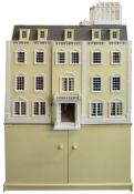 A large modern dolls house in the style of a Georgian mansion: with pillared portico,