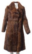 A three quarter length fur coat together with three fur jackets,