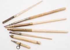 A Victorian ivory sliding pencil with Stanhope finial (image missing) together with six other