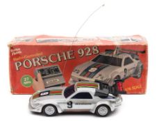 A Radio Shack (Tandy) 1/16 scale model radio controlled Porsche 928 in original box:.