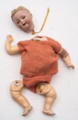 A Simon and Halbig bisque head doll:, the applied blonde wig cut down ,