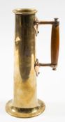 A ship's engine room brass jug:, of plain cylindrical form with wooden handle and flared foot, 30.
