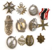 Eight WWII German war badges:, comprising two Merit Crosses, Spanish Cross,