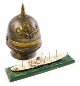 A die cast waterline model of the Holland-American steamer MS Kinderdyk:,
