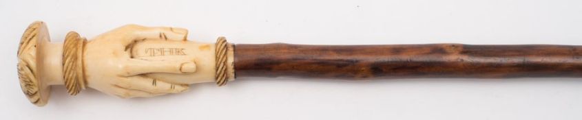 A 19th century carved ivory and blackthorn walking cane:,