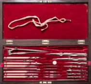 A 19th century rosewood cased polished steel and ivory draughtman's set by W Elliot, London:,