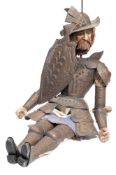 A Continental wooden headed figure in armour, possibly Don Quixote:,