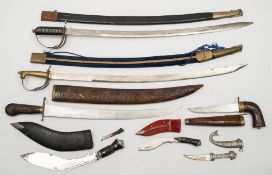 A group of seven Indian reproduction swords and daggers of tradition form:,