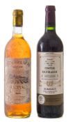 A bottle of 1999 Haut Blagnac Lignac, Carl et Fils, and a bottle of 1983 Ch.