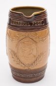 Of WWI interest a Royal Doulton stoneware jug: of barrel shaped form with ribbed strap handle