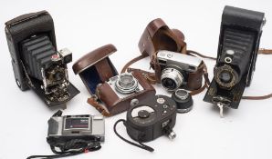 A Werra IV 35mm SLR camera and instructions:, together with a Balda 'Baldina' camera,