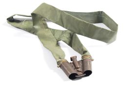 A 12 bore gravity feed or 'Monkey' type cartridge belt:, with single lever dispenser.