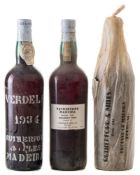 Two bottles of Rutherford and Miles 1934 Maderia Bual:, and one 1954.