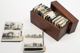 A personalised collection of 26 wallets containing monochrome photographs from the family of