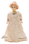 A late 19th century Continental wax shoulder headed doll:, applied wig,