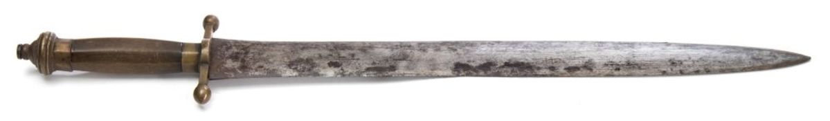 A 19th century Continental sidearm:, the broad double edged blade over a brass hilt with quillons,