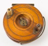 A late 19th Century mahogany Starback fishing reel:, unsigned,