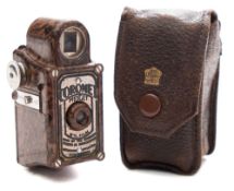 A Cornet 'Midget' bakelite camera:, in a brown colour,
