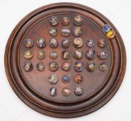 A 19th century mahogany solitaire board together with a collection of 19th century and later