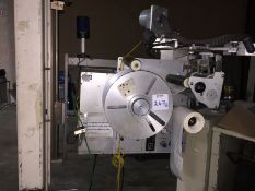 LSI Label Applicator with build in vacuum pump Model 96T0 Serial No. 1023162 designed to apply pre-