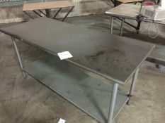Stainless Steel Table with SS Legs and galvanized steel base shelving. Rounded edges on the length