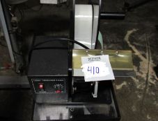 Label Dispenser comes with manual and on stand with casters (Rigging and loading fees included in