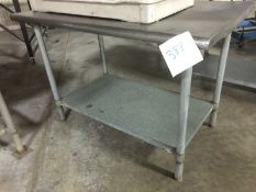 Stainless Steel Table with SS Legs and galvanized steel base shelving. Rounded edges on the length
