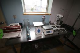 Contents of Table Top, Inlcudes (2) Scales, (2) Sealers, (1) Knife Sharpening Station, (6) Scoring