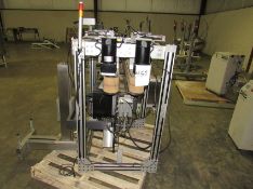 Quadrel Labeling System with Sato Label Printer - was used for printing and applying round labels to