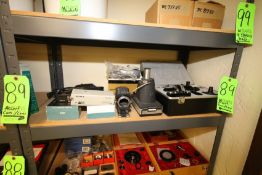 Lot of Assorted Nikon Camera Equipment, Includes Camera Body, Lenes, Flashes, Cases, and Other