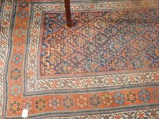 Antique Persian-style wool carpet, the central field with allover stylised floral decoration,