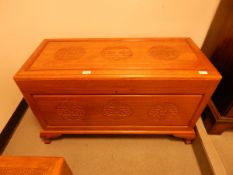 Oriental hardwood coffer with oriental patterns, on shaped bracket feet,