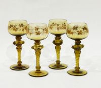 Set of nine German green glass roemers, the bowls decorated in gilt with vine leaves and grapes,