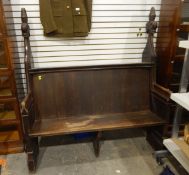 19th century oak pew of Gothic-style, having carved finials and solid seat,