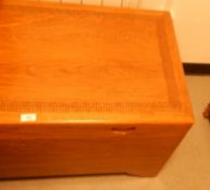 Hardwood coffer with carved boards, shell shaped handles,