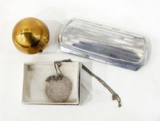 Pygmalian compact in an engine-turned spherical case, in black draw-string bag,