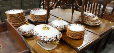 A Copeland Spode part dinner service decorated with a band of flowers in the Imari palette,