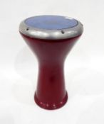 Pedestal 'Djembe' drum with red painted metal base, the top dated 1995 and inscribed 
