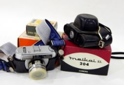 Pentax K1000 SLR camera, a Halina camera, a boxed Brownie camera,