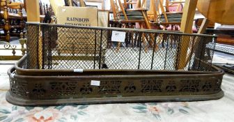 Two brass fire curbs and two brass fenders (4)