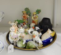 19th century spill vase modelled as a lady seated with a stringed instrument,