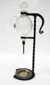 Wine dispenser, the bulbous glass body etched with deer,